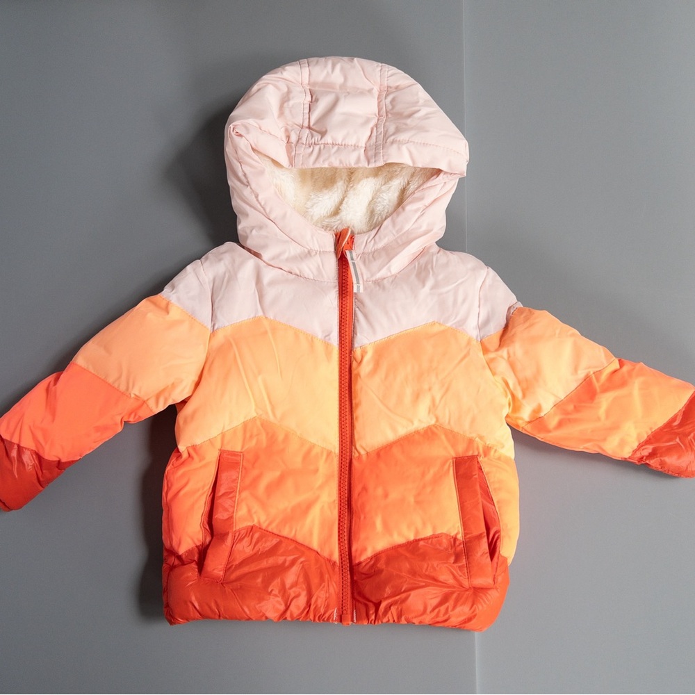 Bright puffer jacket. Fun colors. Sherpa lined hood.